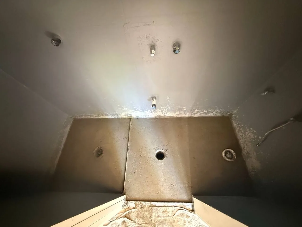 Bathroom floor preparation and screed with drain openings