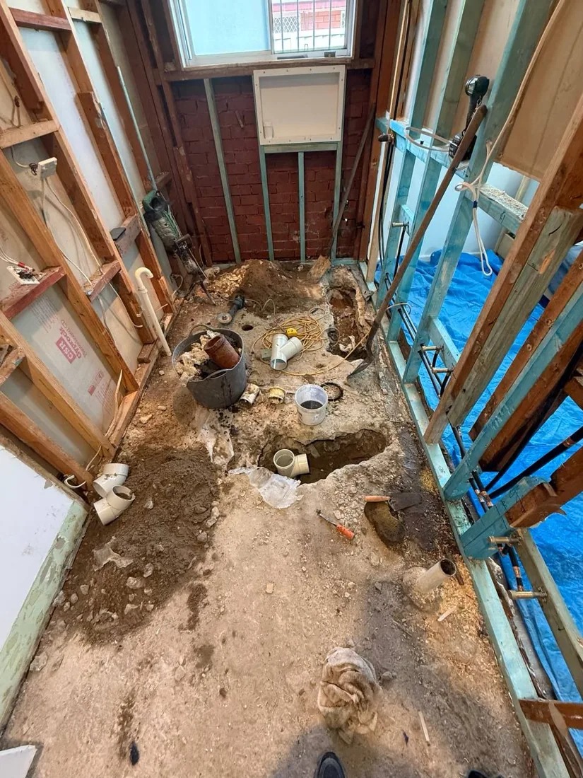Original bathroom stripped back to expose the floor and wall framing
