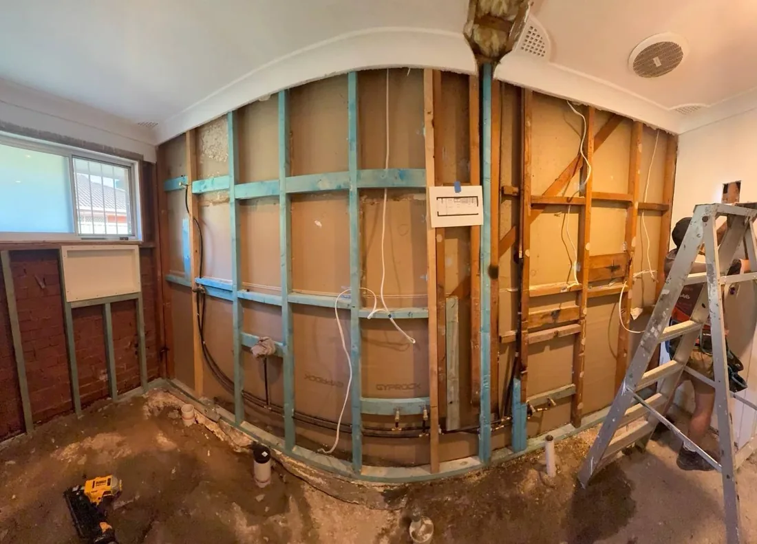 Exposed timber framing and existing services during the renovation
