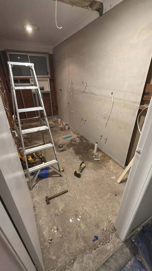 Bathroom wall lining installed ahead of finishing