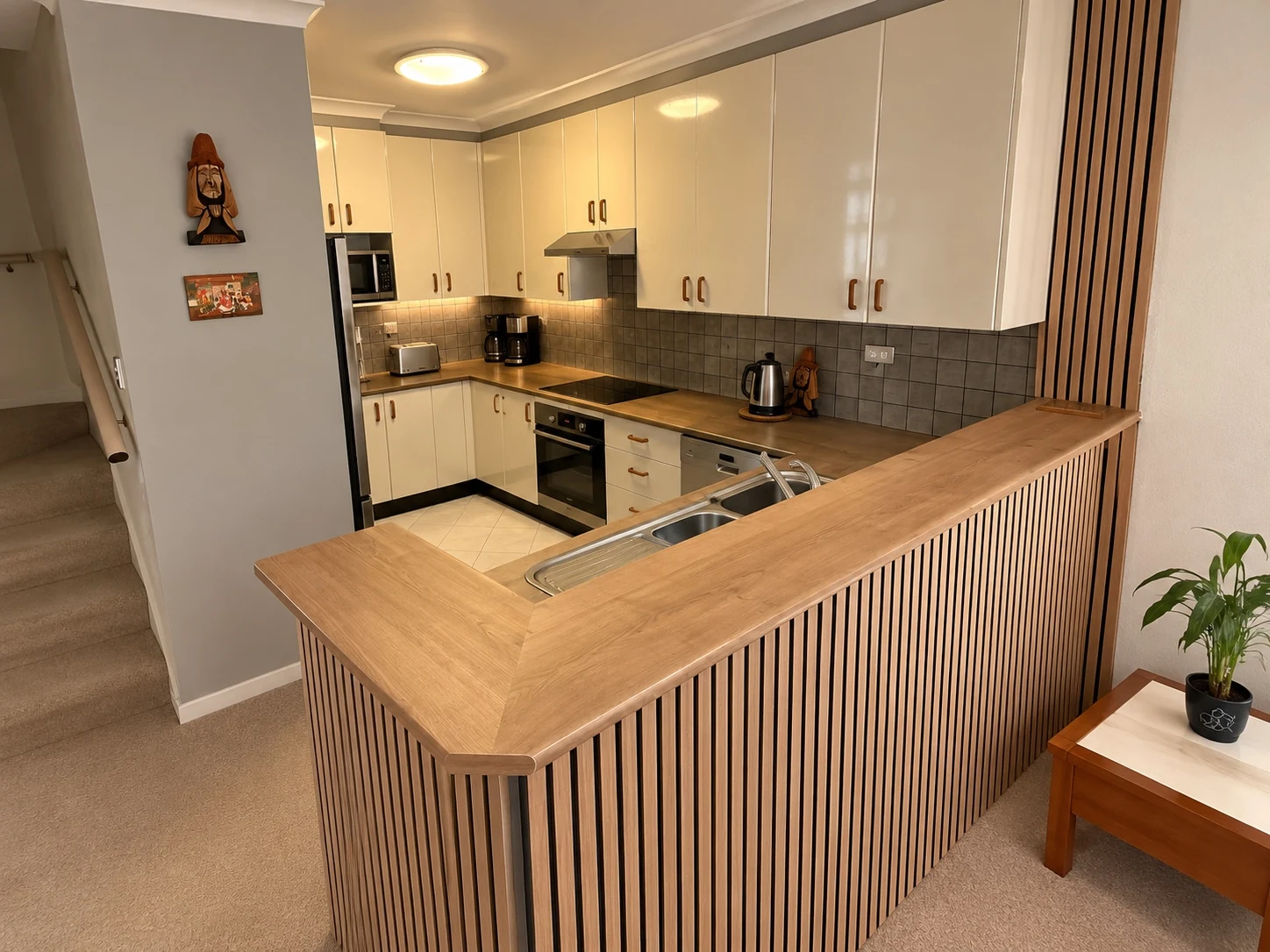 Rosebery kitchen refurbishment after photo with timber slat feature and updated breakfast bar