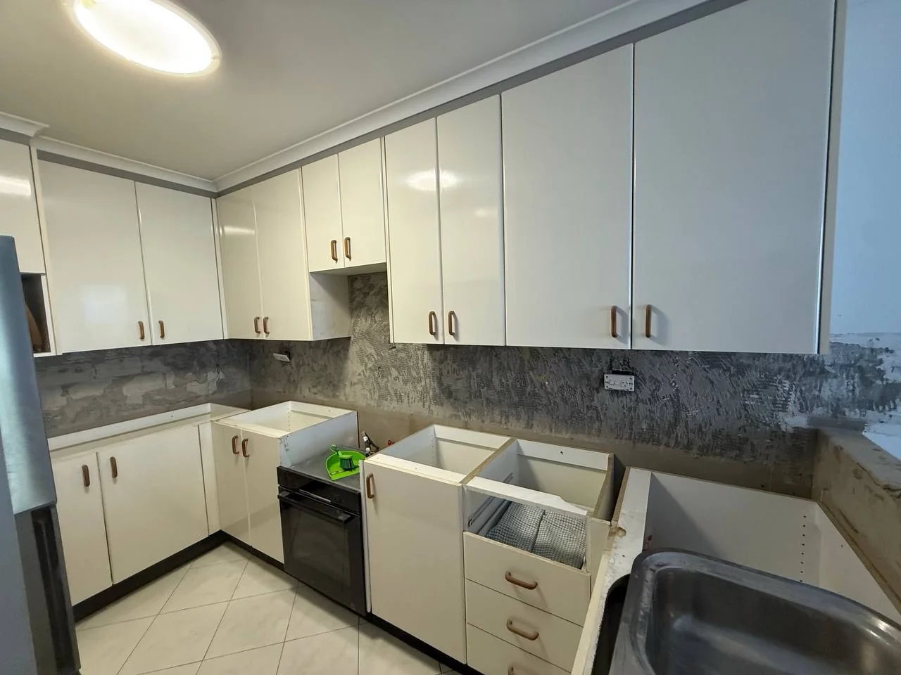 Rosebery kitchen lower cabinetry opened during refurbishment