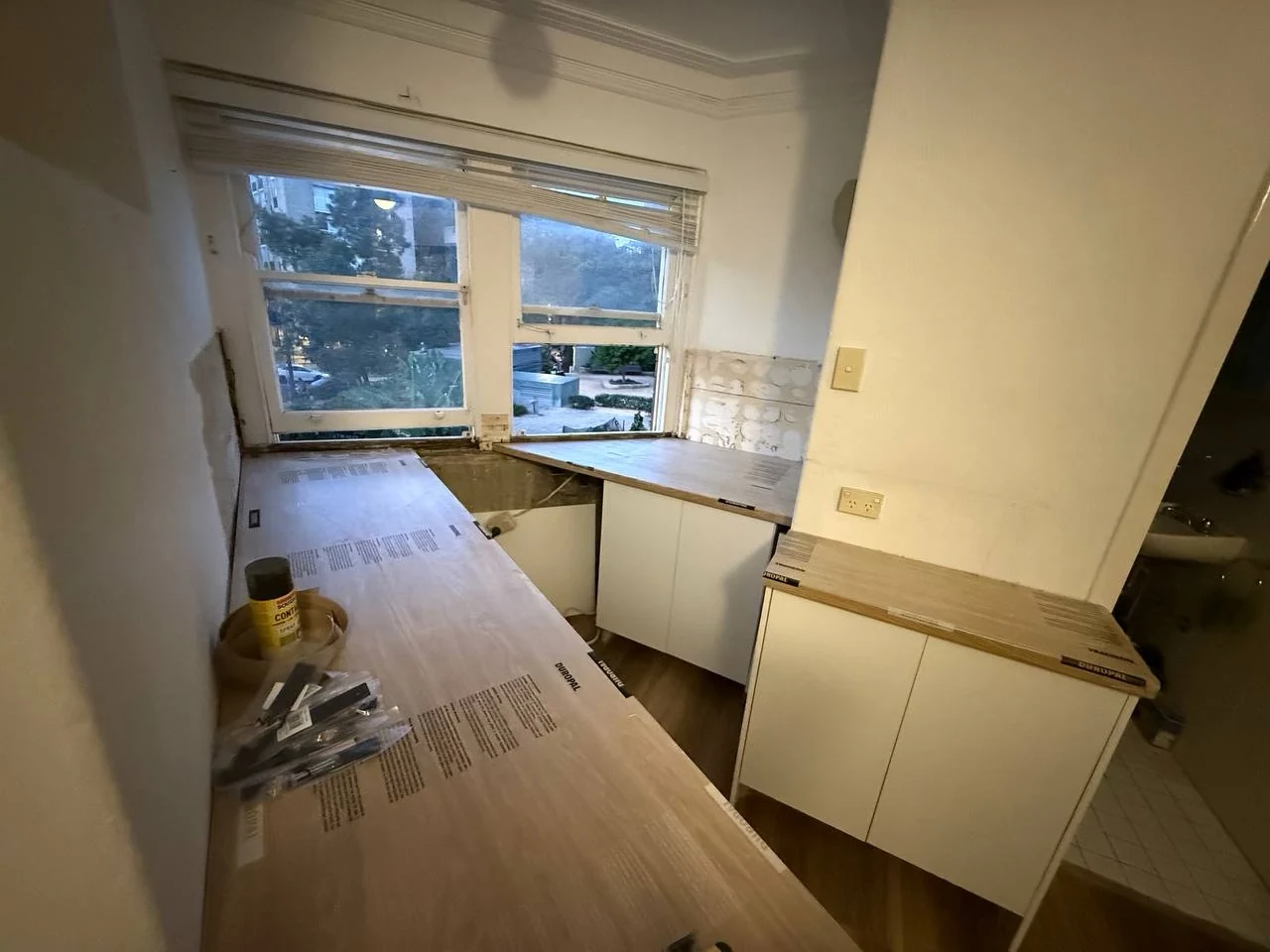 Kitchen benchtops and cabinetry being fitted